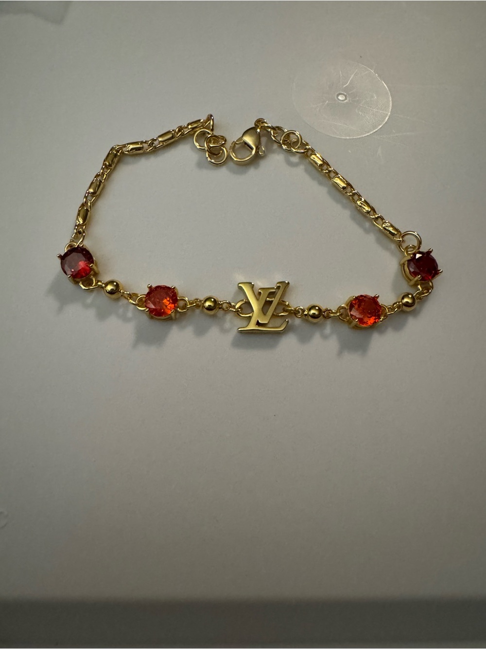 Gold-Tone Bracelet with Red Gem Accents - Picture 2 of 3